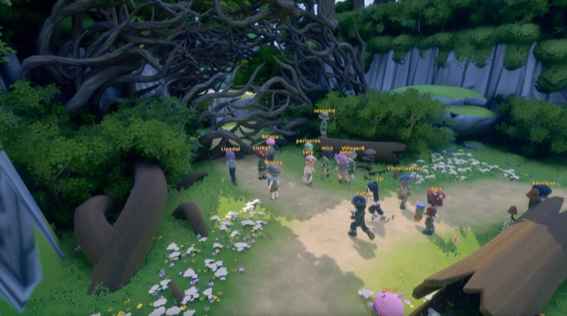 A group of players exploring a forest clearing in Loftia